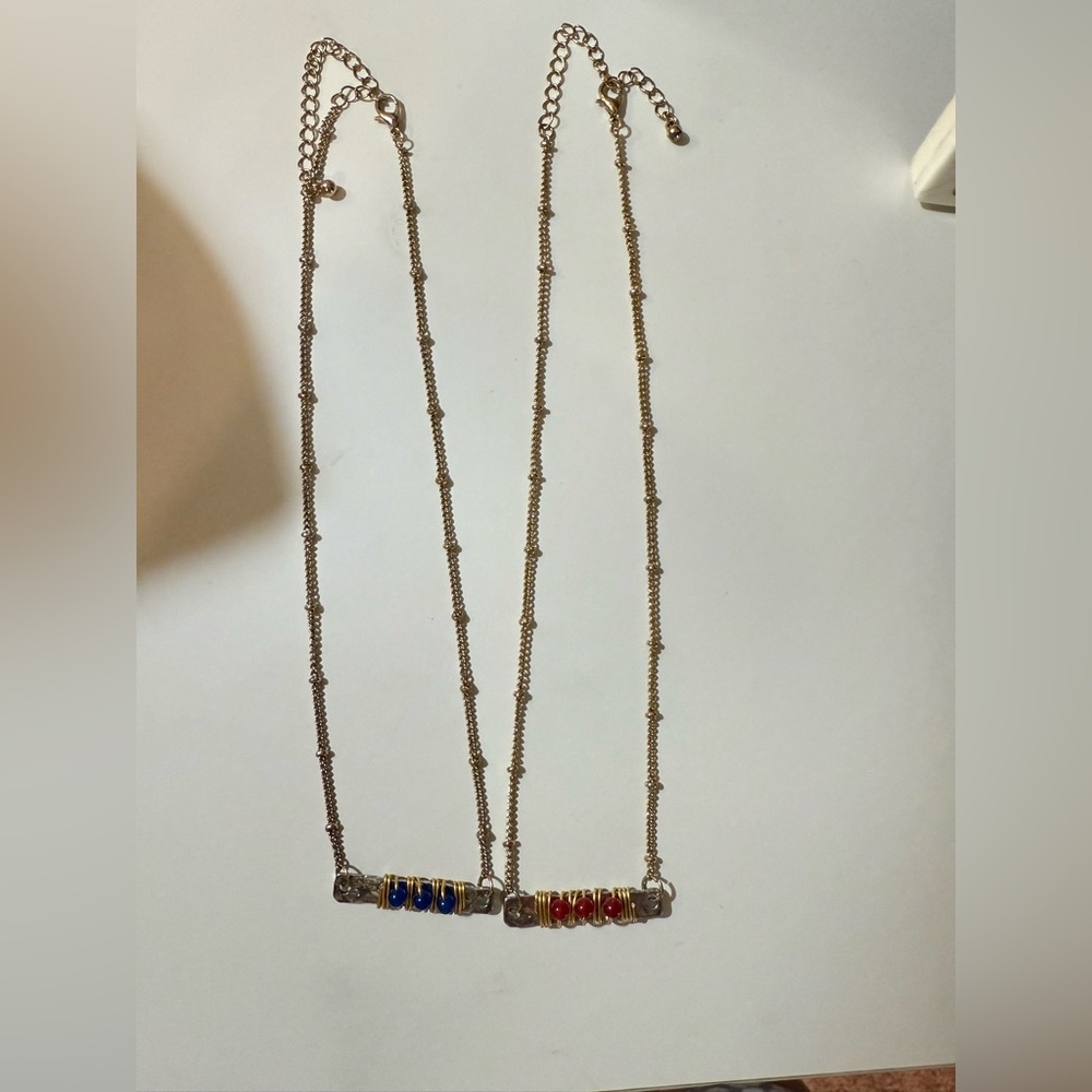 Elegant Gold Necklace with Red and Blue Accents